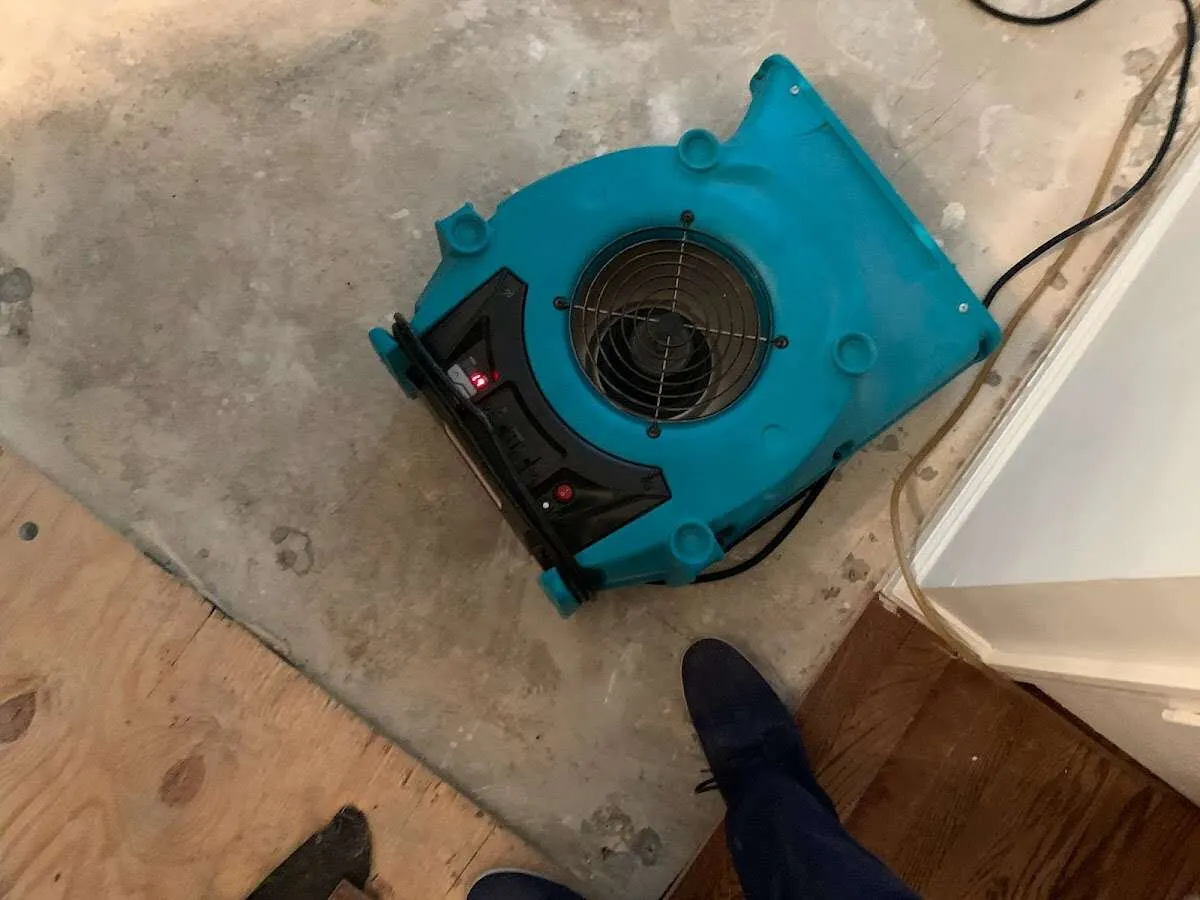 Air mover drying subfloor during Leak Detection & Repair in Trumann